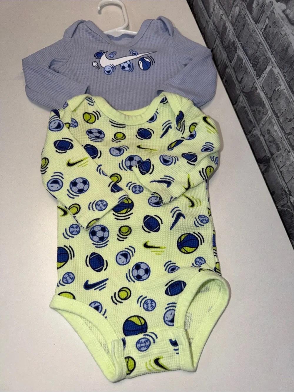 2 Baby Nike Long-Sleeve‎ Baby One-Piece in Light Blue and Yellow Soccer Print
